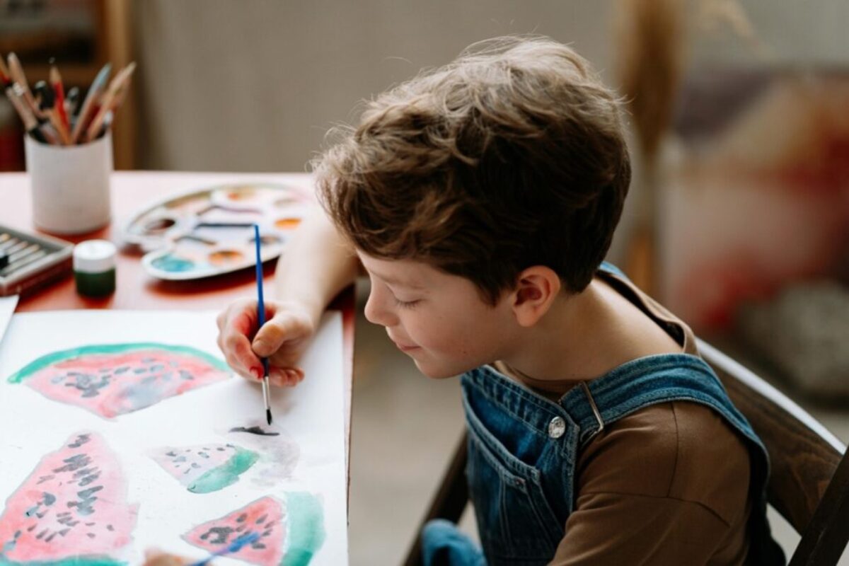 Art Therapy and ADHD showing a boy with ADHD drawing water melons