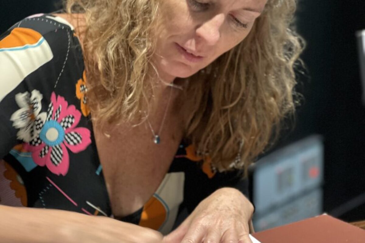 Your Dream Career Awaits: Become a Qualified Art Therapist with CECAT - image of one of CECAT's successful female students who is focused on her image in front of her.